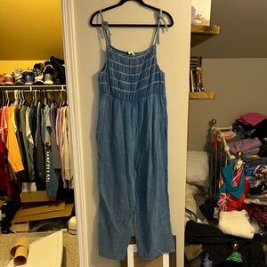 Davi & Dani size large blue jumpsuit with smocked top and pockets and tie straps
